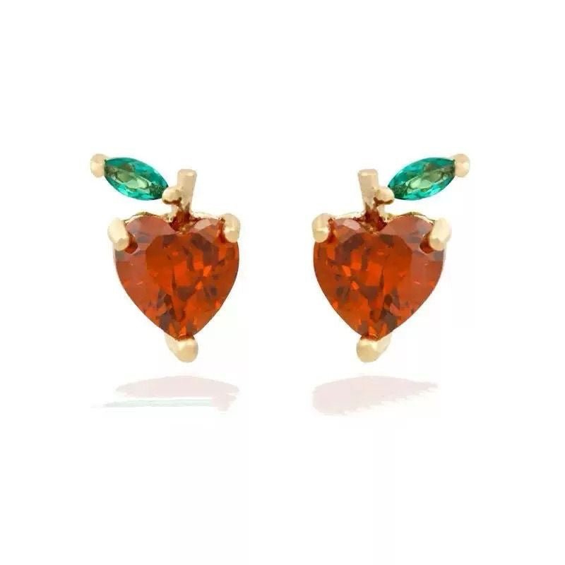 Mini fruit-shaped gold-filled stud earring on white background